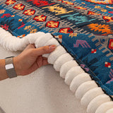 Quilted sofa throw with oriental pattern
