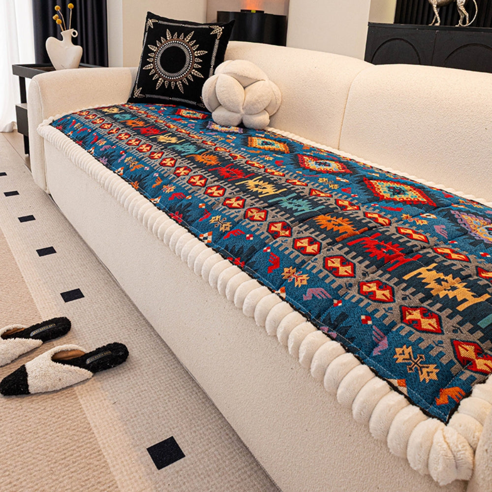 Quilted sofa throw with oriental pattern