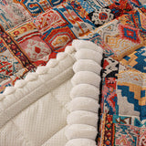 Quilted sofa throw with oriental pattern