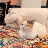 Quilted sofa throw with oriental pattern