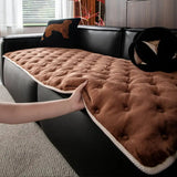 Quilted sofa cover with deep relief