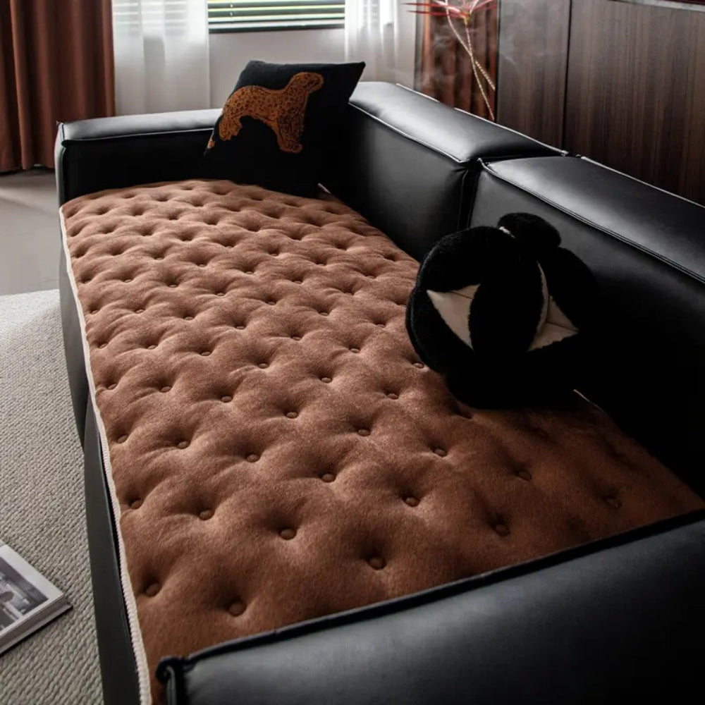 Quilted sofa cover with deep relief