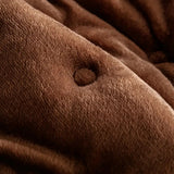 Quilted sofa cover with deep relief