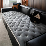 Quilted sofa cover with deep relief