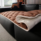 Quilted sofa cover with deep relief